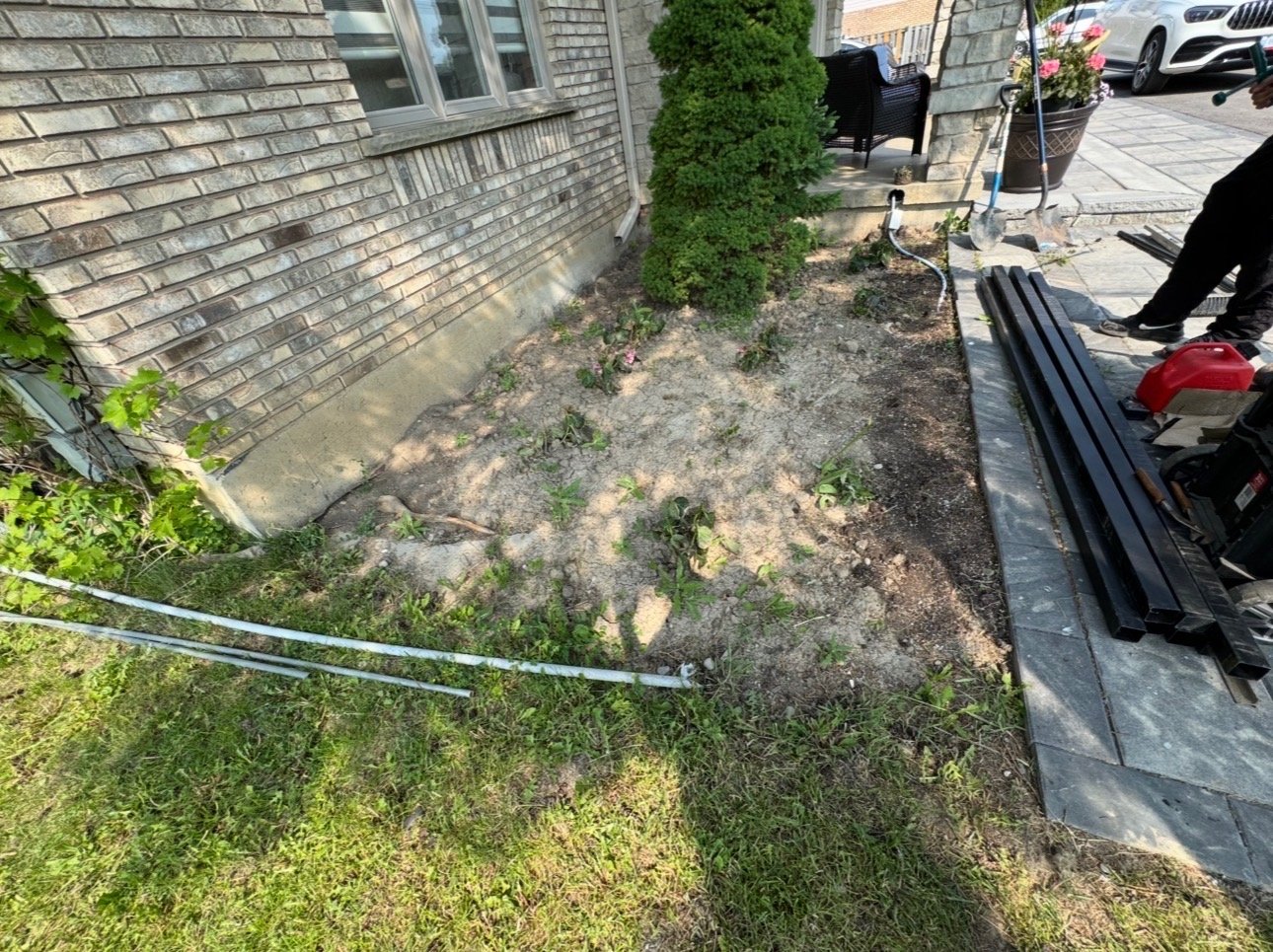 Tired garden bed before mulch installation