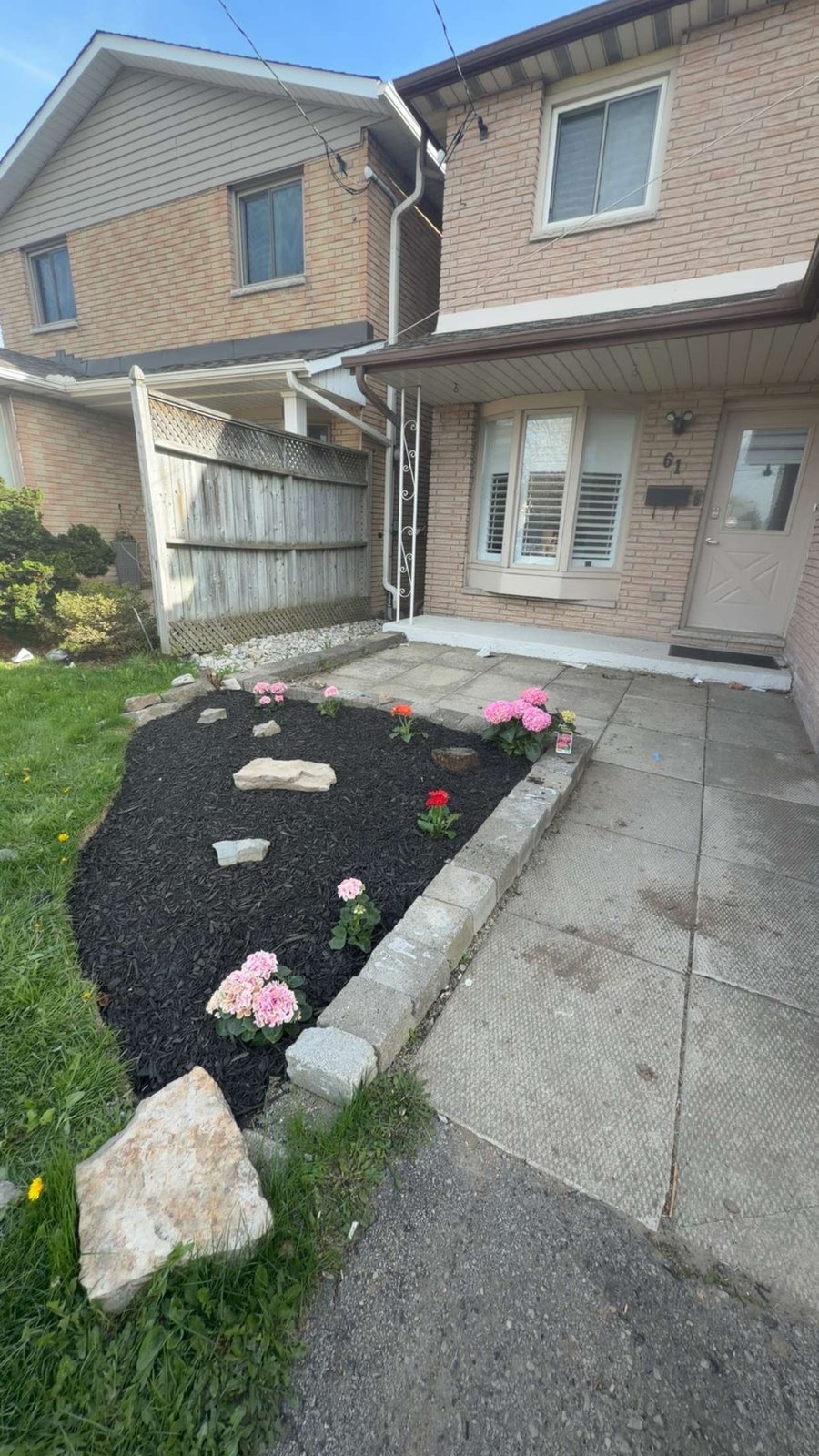 Fresh front-yard garden bed with planting by OSS Lawn Care